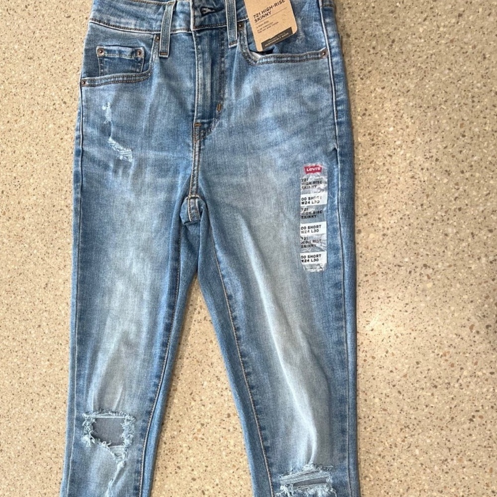 Girls Levi Ripped Boot Cut Jeans.